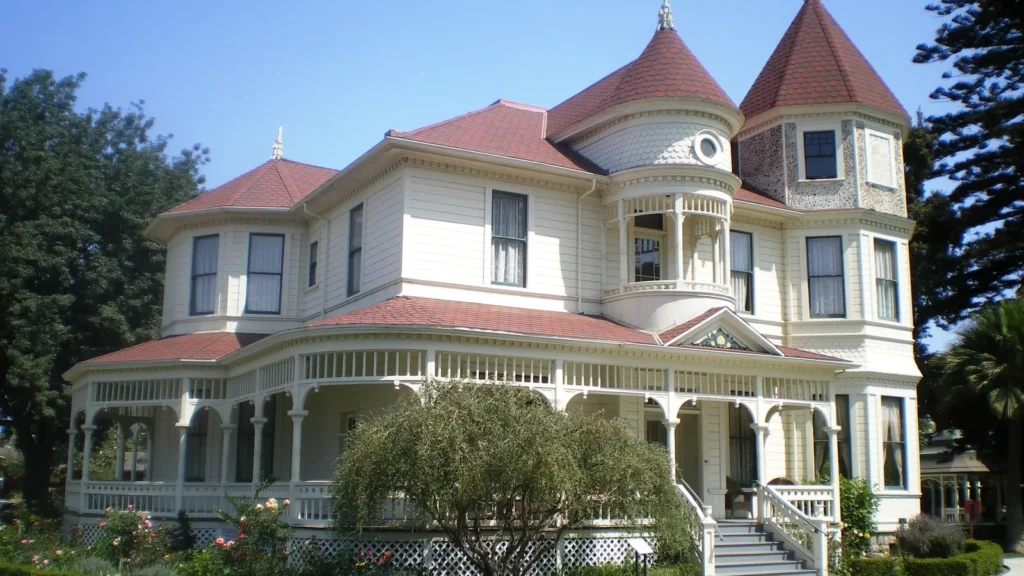The Camarillo Ranch House, a white Victorian house with red turret roofs, in Camarillo