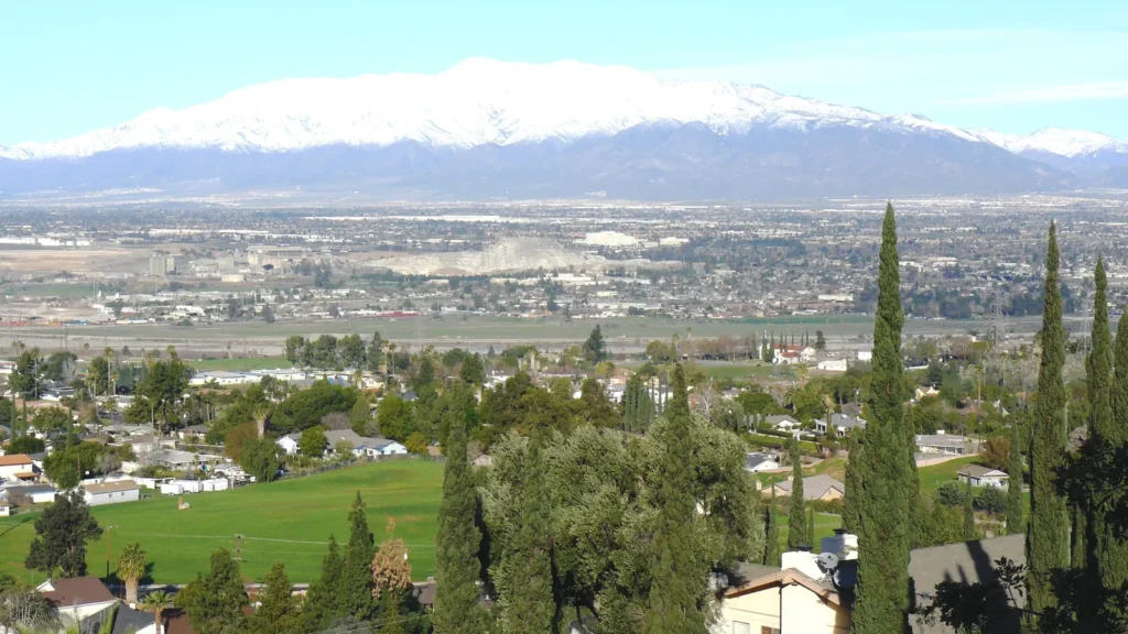View over the homes of Grand Terrace toward snow-capped mountains