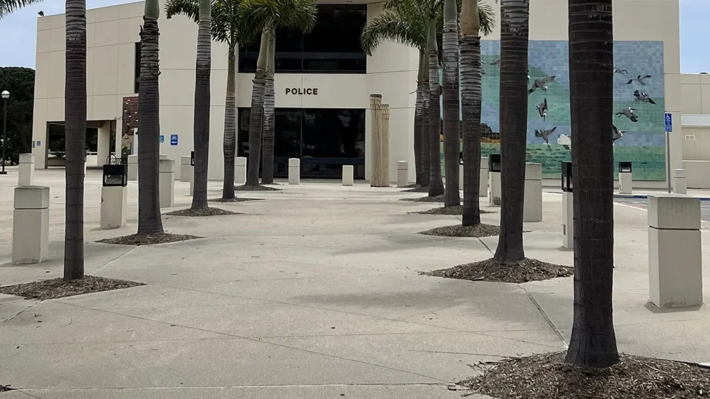 Palm-lined entrance to the Huntington Beach Police Department on Main Street