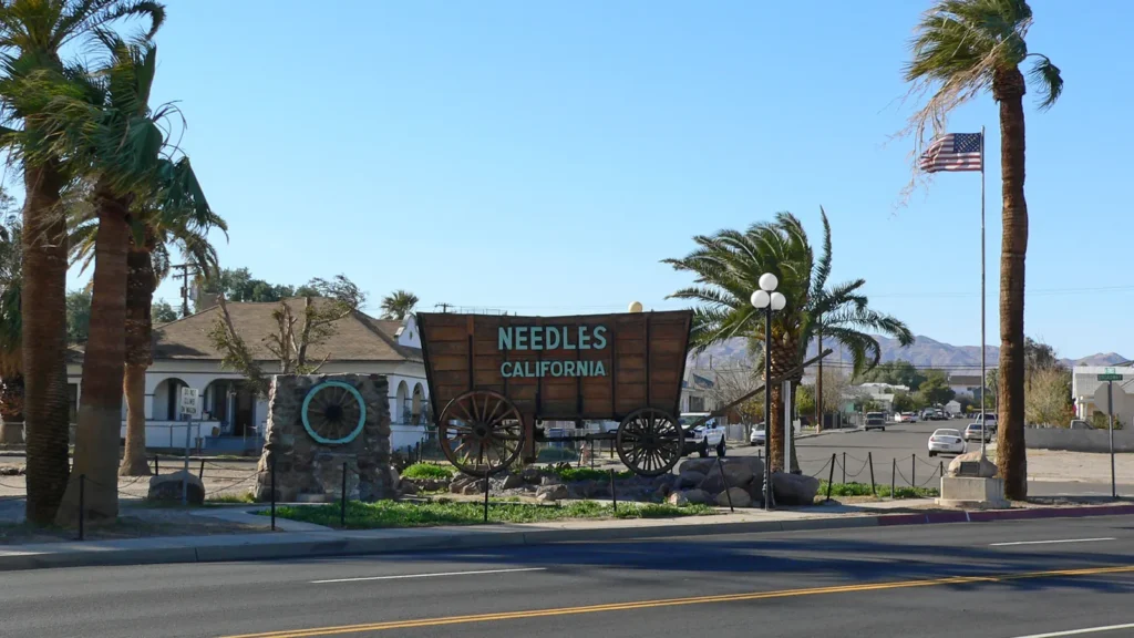Needles, California welcome sign with palm trees