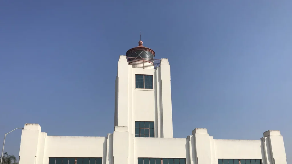 The white Art Deco Port Hueneme Lighthouse against a blue sky
