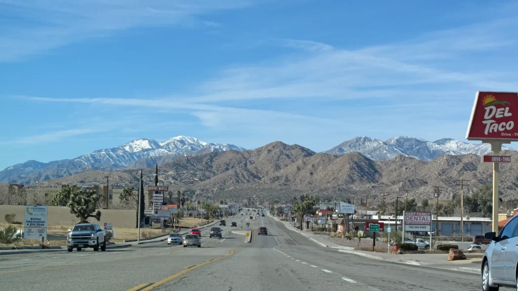 Twentynine Palms Highway through Yucca Valley with mountains beyond
