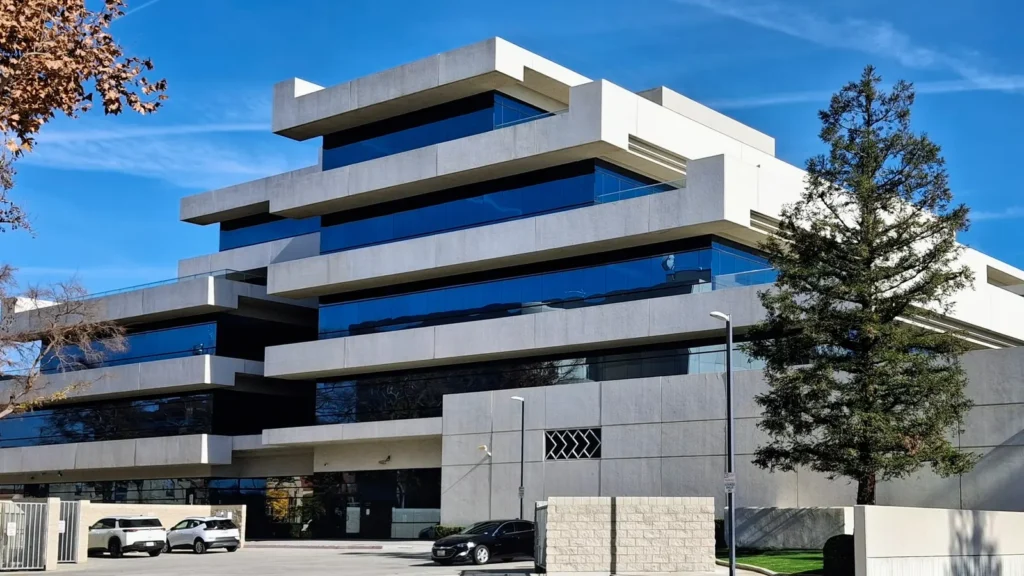 The County of Kern Administrative Center, a terraced white building with blue glass, in downtown Bakersfield