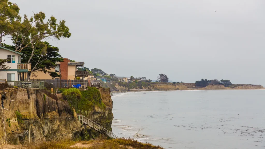 Sandstone bluffs and homes of Isla Vista above the beach and the Pacific Ocean