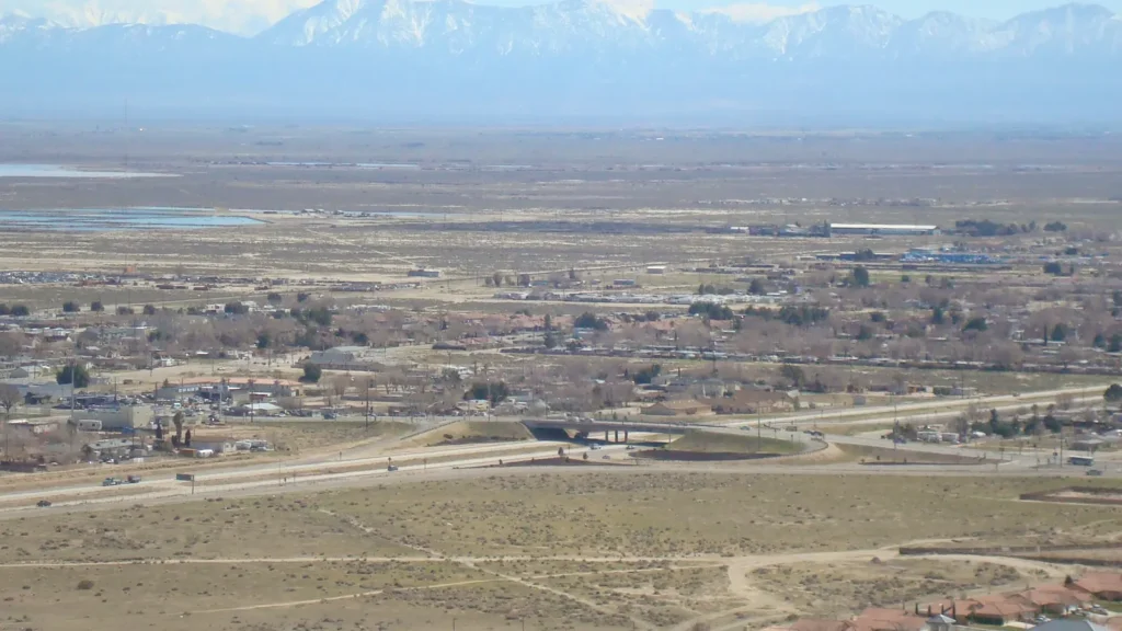 A view over the town of Rosamond with snow-capped mountains in the distance