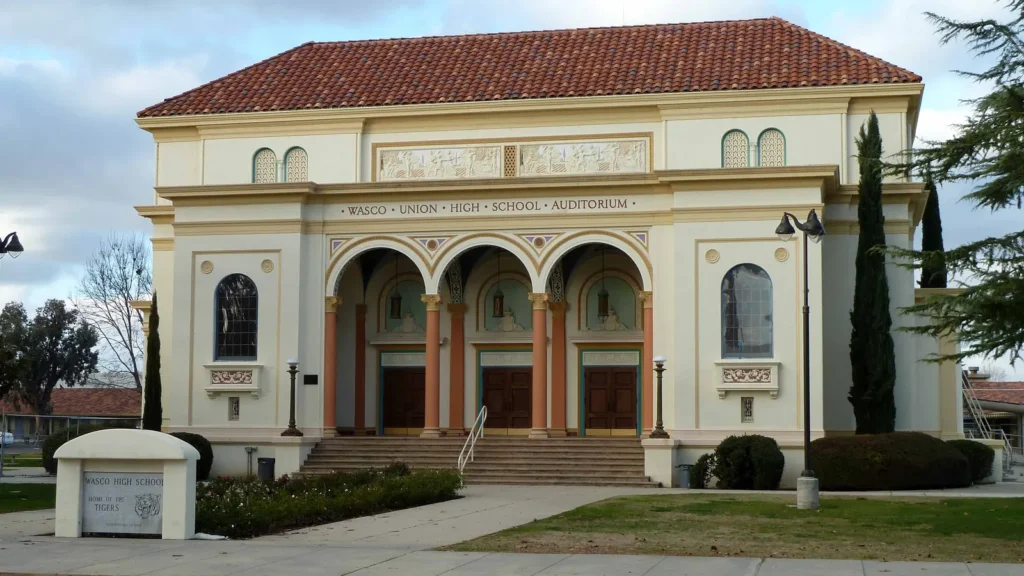 The tile-roofed Wasco Union High School auditorium with arched entries
